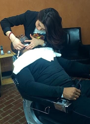 Lady Business Woman Shaves Man's Beard with Straight Razor